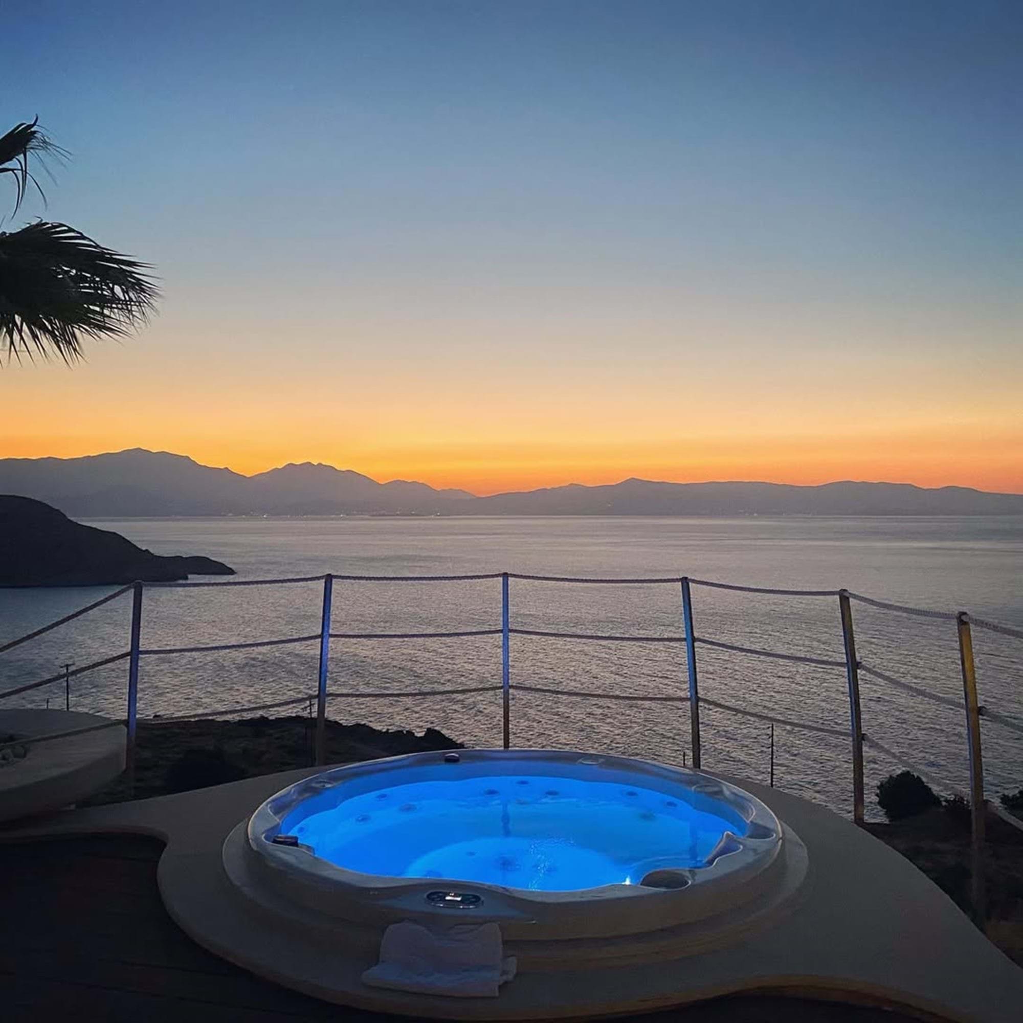 Jacuzzi overlooking the sea at sunset