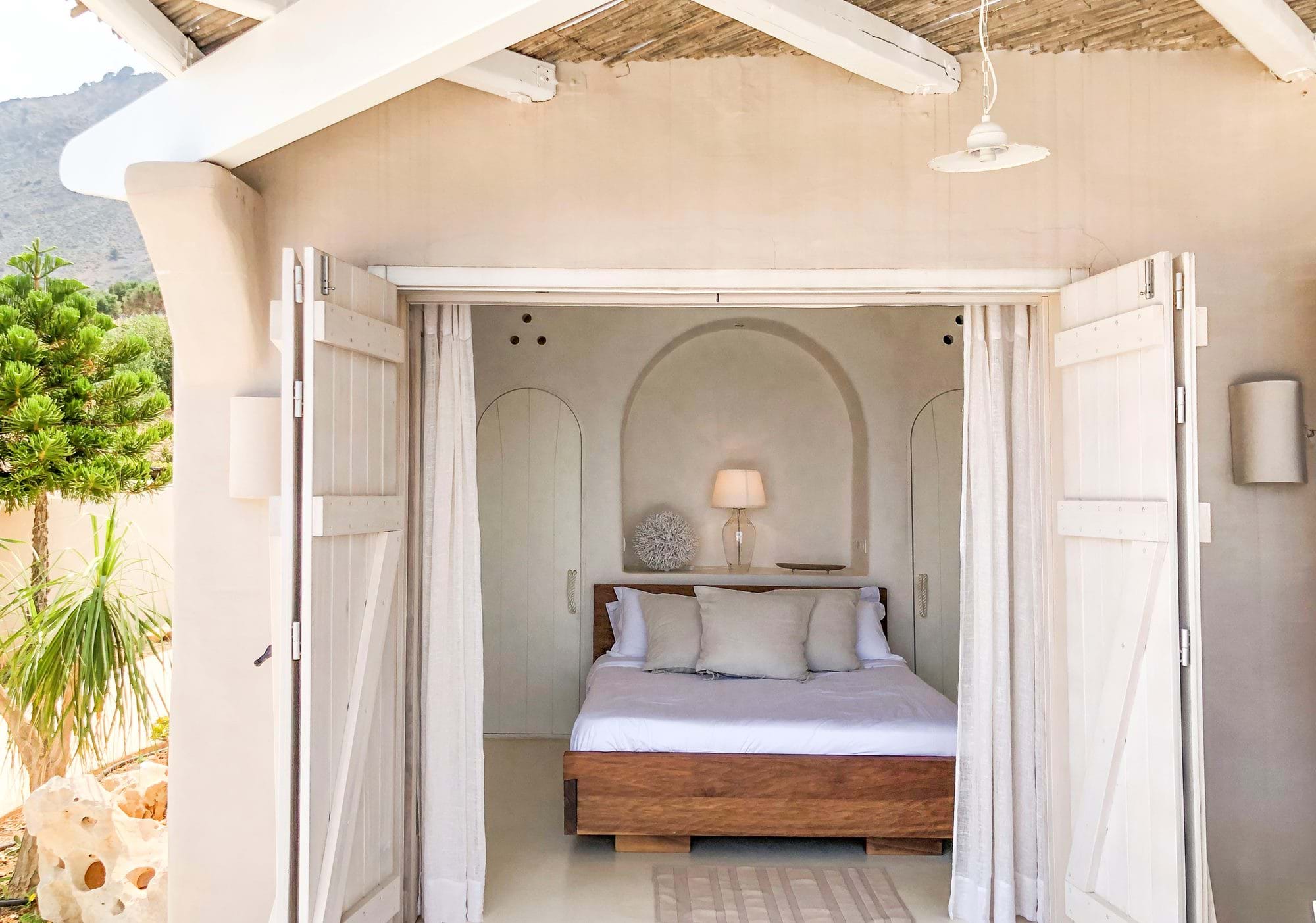 Bedroom with open shutters