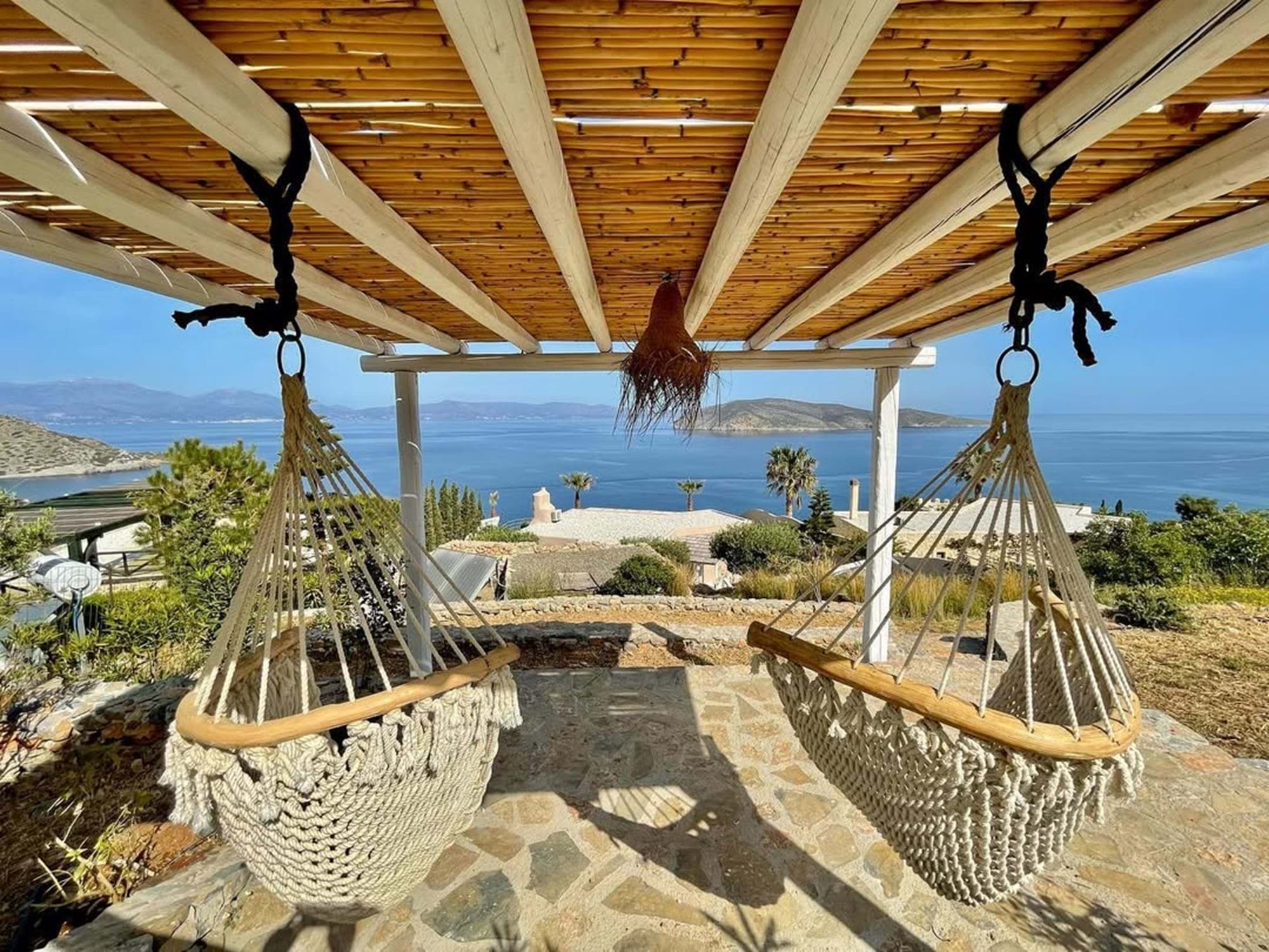 Shaded pergola with hammocks facing the gulf